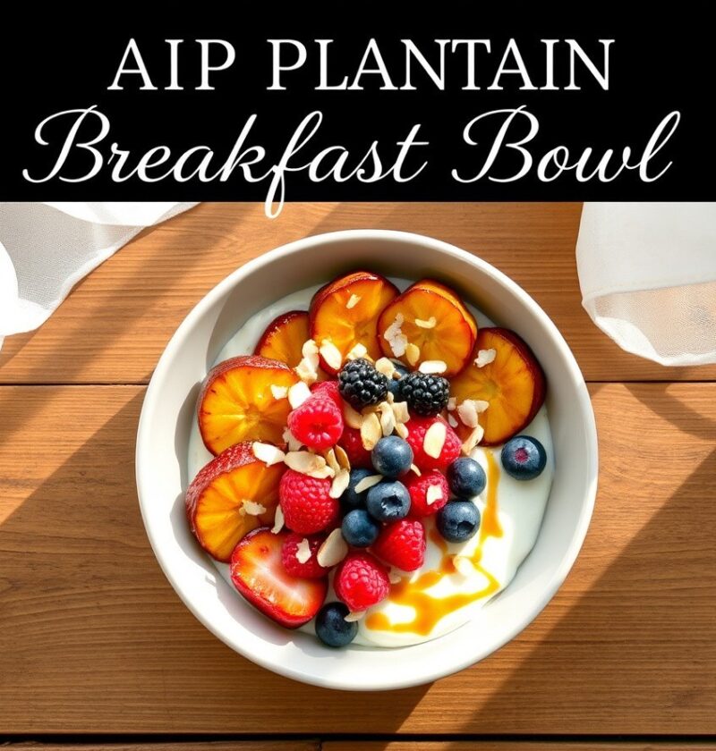 A beautifully arranged AIP Plantain Breakfast bowl featuring a creamy base topped with vibrant red raspberries, blue blueberries, sliced red-orange plantains, and slivered almonds, with a drizzle of syrup, on a wooden surface.